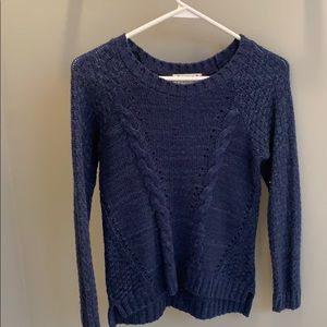 a blue sweater